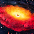 Artist’s impression van CAPERS-LRD-z9, het moederstelsel van het verst bekende zwarte gat, dat waarschijnlijk in een dichte gaswolk is gehuld, die het stelsel rood doet kleuren. © Erik Zumalt/The University of Texas at Austin