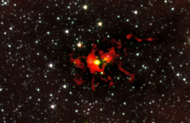 ALMA neemt de geboorte van een monsterster waar. Credit: ALMA (ESO/NRAJ/NRAO)/NASA/Spitzer/JPL-Caltech/GLIMPSE