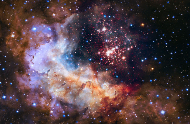 De sterrenhoop Westerlund 2 gefotografeerd door de 25 jaar oude Hubble-telescoop. (c) NASA/ESA/STScI