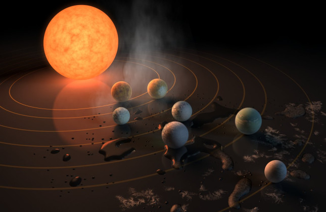 Astronomen van de Universiteit van Amsterdam verklaren met een model hoe het kan dat rond het zonnestelsel Trappist-1 (hier een artistieke impressie) zeven planeten van aardformaat dicht rond hun ster draaien. De crux zit op de grens waar ijs in water ver