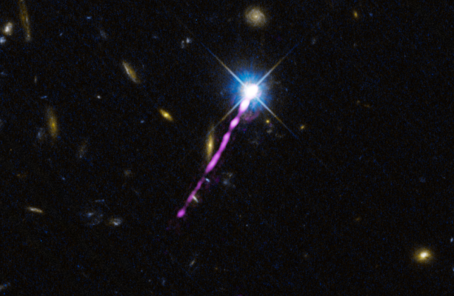 De radio-jet van de quasar 4C + 19.44, aangedreven door een superzwaar zwart gat in het midden van zijn sterrenstelsel, schijnt fel op radiogolflengten, zoals gezien door de LOFAR-radiotelescoop (magenta). De achtergrondafbeelding toont naburige sterrenst