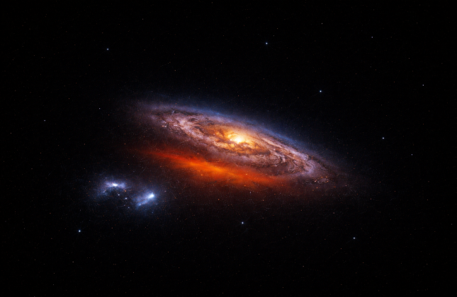 Artistieke impressie van de Melkweg, met linksonder de twee satellietsterrenstelsels de Grote Magelhaense Wolk en de Klein Magelhaense Wolk. (c) Filippo Fraternali