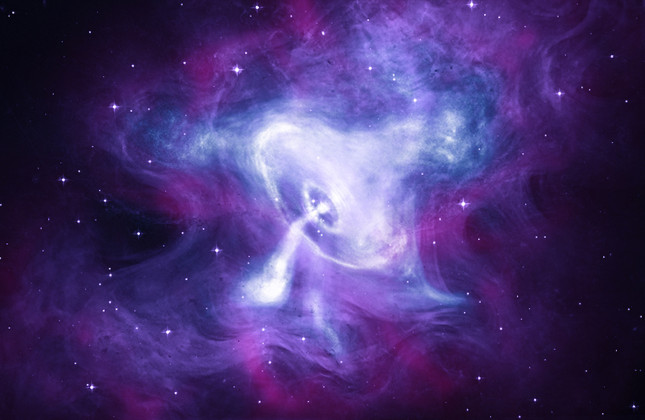 Deze opname, gemaakt op verschillende golflengten, toont de pulsar (een soort neutronenster) in het centrum van de supernovarest die bekendstaat als de Krabnevel. © [X-ray: NASA/CXC/SAO; Optical: NASA/STScI; Infrared: NASA-JPL-Caltech]
