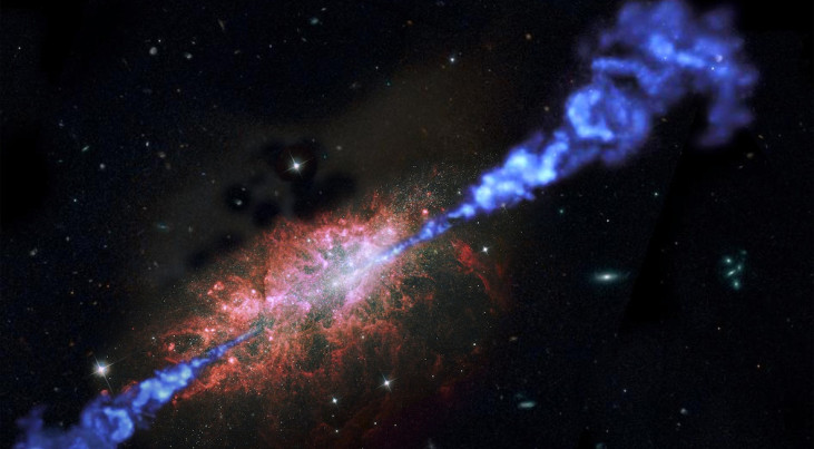 Een artist's impression van een radiosterrenstelsel waarin zich snel sterren vormen. De radiostraling is in blauw; in het sterrenstelsel zijn veel felle nieuwe sterren te zien. Credit: ESA/NASA/RUG/MarcelZinger