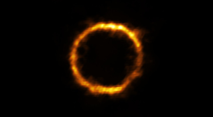 Gelensd beeld van een extreem ver sterrenstelsel dat verrassend veel op onze Melkweg lijkt. Credit: ALMA (ESO/NAOJ/NRAO), Rizzo et al.