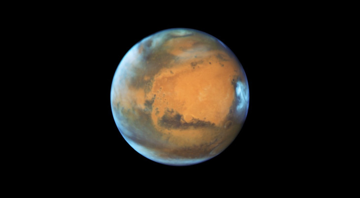 Foto van Mars gemaakt door ruimtetelescoop Hubble. Zo mooi zullen we het vanaf aarde niet zien. (c) NASA & ESA