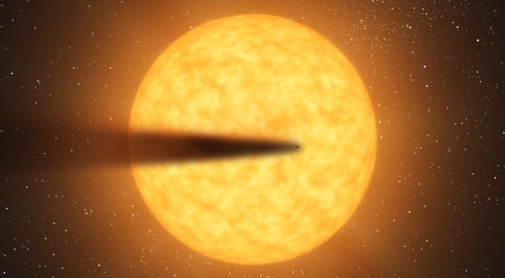 Artistieke impressie van een komeetachtige staart van een mogelijke, uiteenvallende kandidaat-planeet ter grootte van Mercurius terwijl deze voor zijn moederster langs beweegt.  Credit: NASA/JPL-Caltech