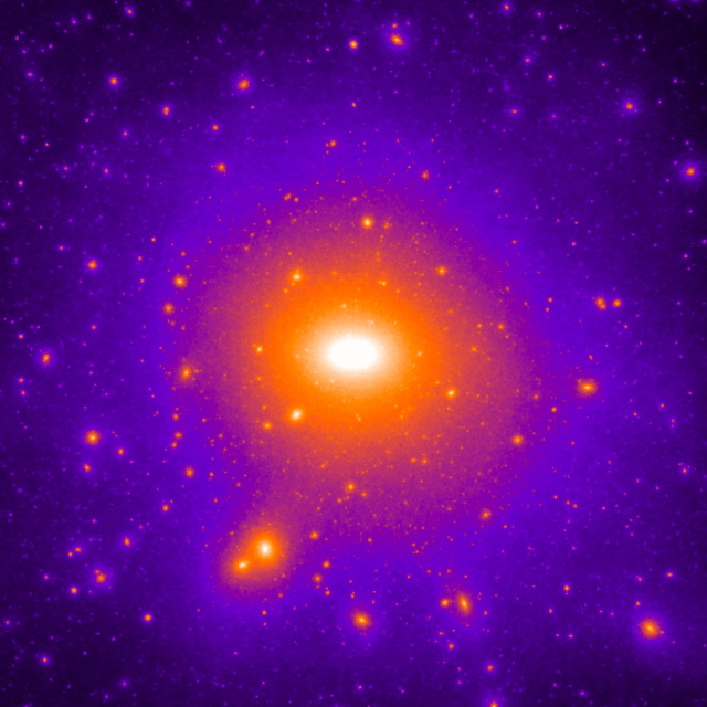 Afbeelding van een donkere-materiesimulatie van een galactisch systeem. Het beeld toont een centraal object dat omgeven is door duizenden satellieten, maar slechts enkele lijken op de satellietstelsels die de Melkweg omgeven en bevatten sterren (Credit: F